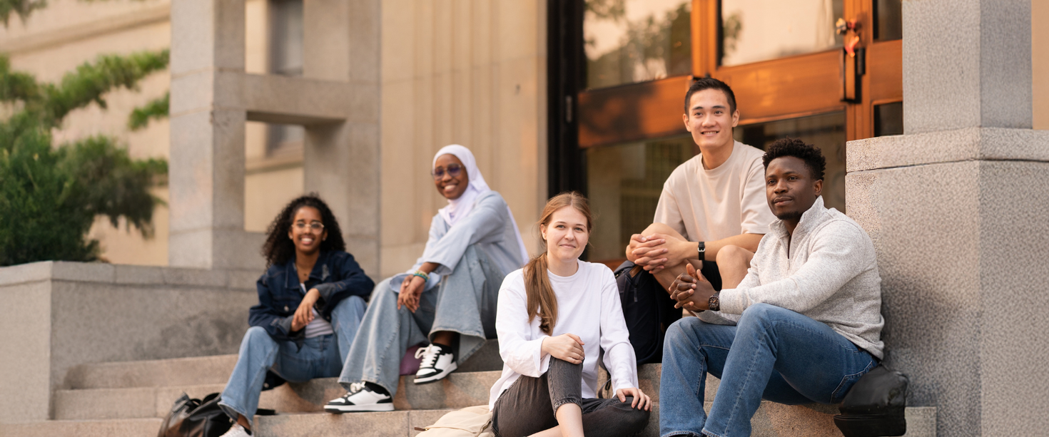 Students sitting in the stairs at Tabaret