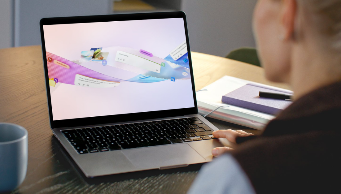 Person in front of laptop with Microsoft Copilot visual