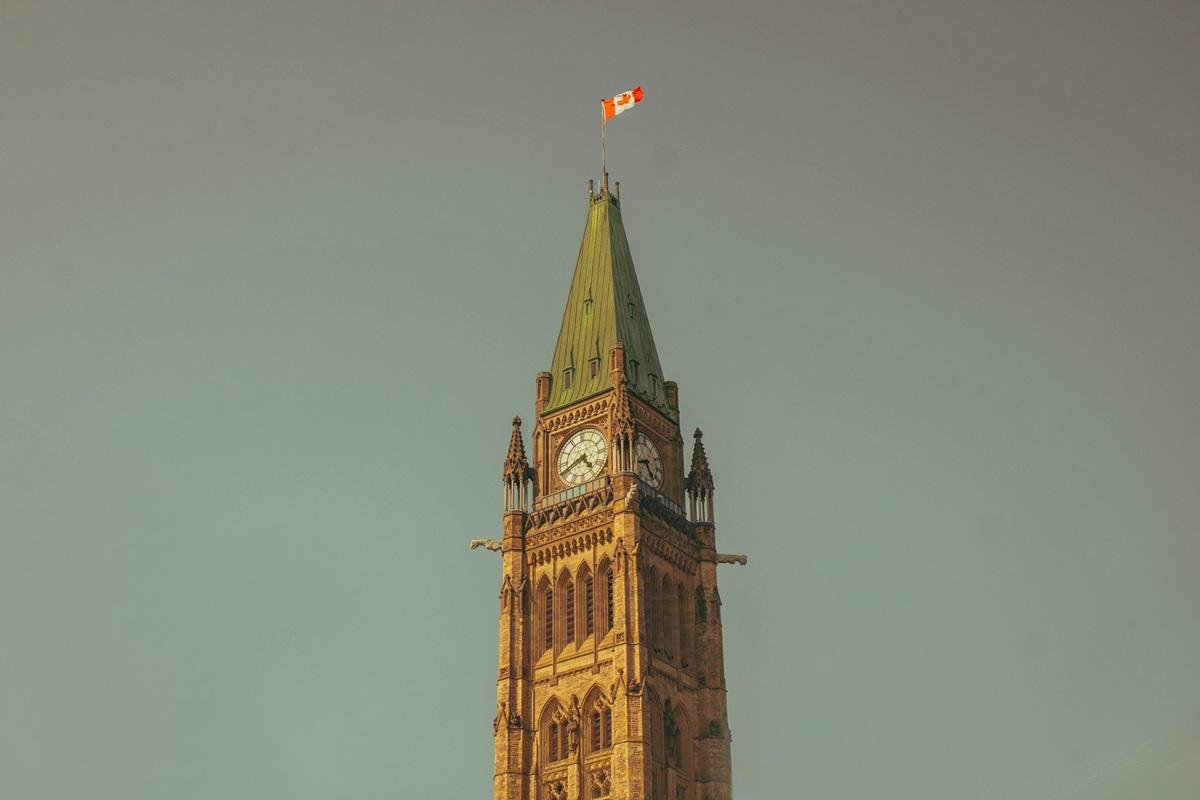 Canada flag waving in front of parliament