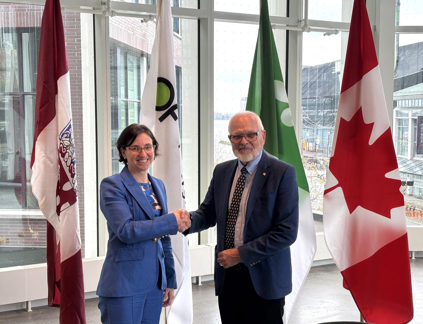 University of Ottawa president and vice-chancellor Marie-Eve Sylvestre shakes hands with Université de l'Ontario français president and vice-chancellor Normand Labrie.