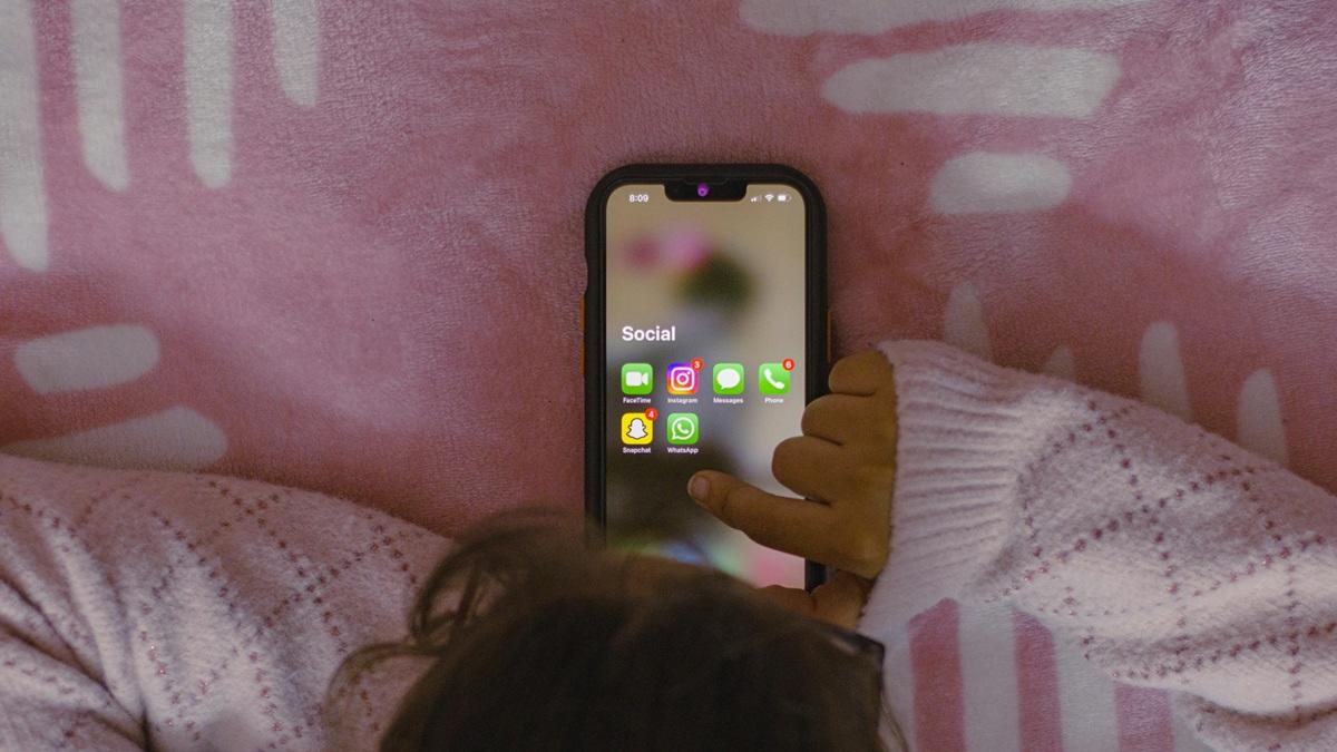 Teen on social media on phone