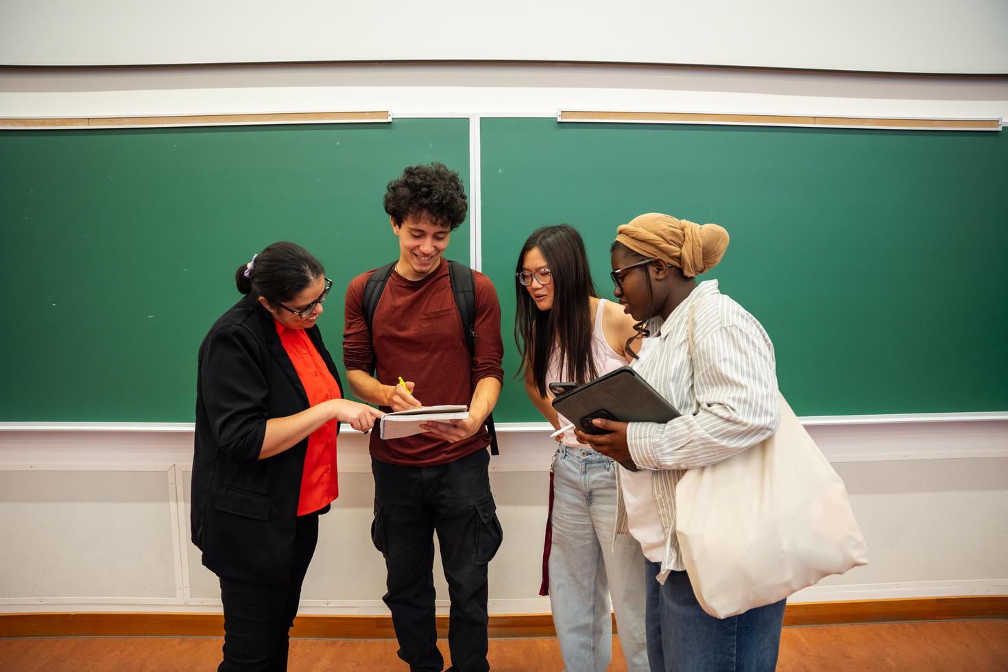Students talking to their professor 