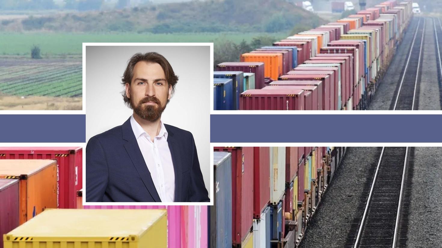 Portrait of a male professor with a train track background