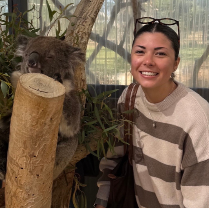Emma Champagne with a Koala in Australia.