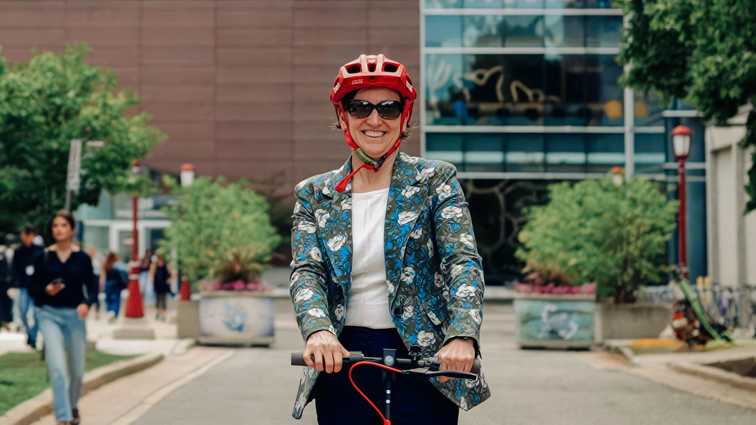 Marie-Eve Sylvestre on a scooter on campus