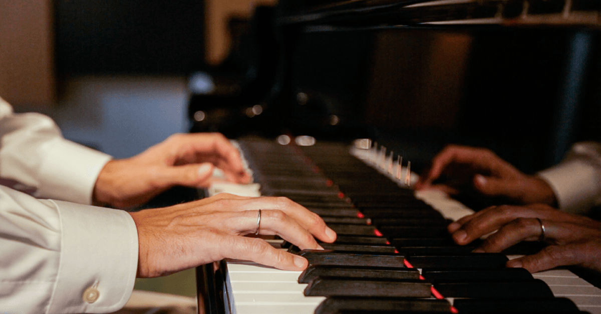 Close-up of hands on piano keys