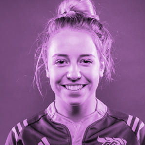 Erin Mccallan, smiling in her Gee-Gees shirt