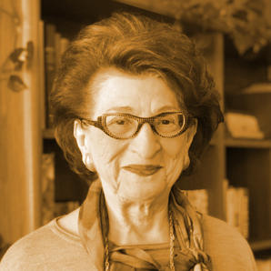 Marina Kun, smiling in her home