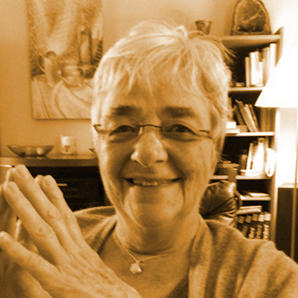 Michèle Wilson, smiling in her house