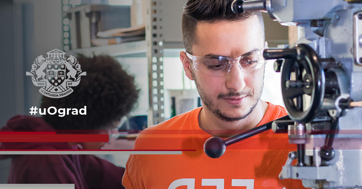 Humam uses drill press wearing safety glasses and orange t-shirt