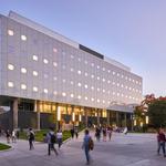 A picture of one of the buildings of uOttawa's faculty of Engineering. A sunset in background